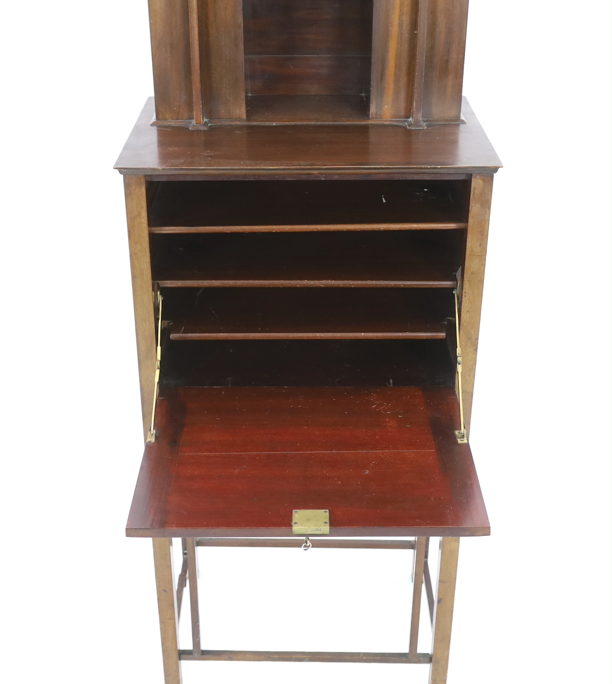 An early 20th century Arts & Crafts inlaid mahogany music cabinet, made by George Montague Ellwood and retailed by J.S. Henry of London